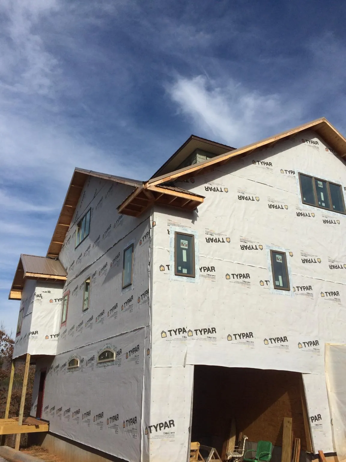 Stick built house wrapped in Typar with new roof framing and dormers in Forest Park